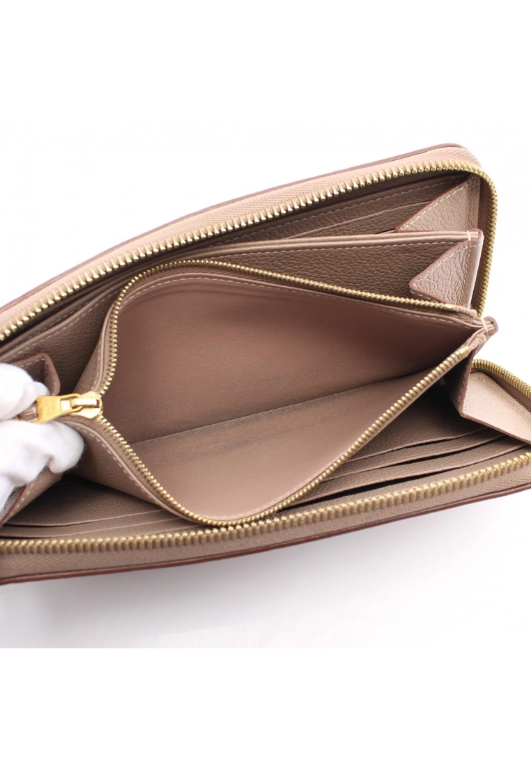 Pre-loved LOUIS VUITTON Classic Monogram empreinte embossed Rounded corner zipper long Genuine Leather Wallet Beige 7 Pre-loved LOUIS VUITTON Classic Monogram empreinte embossed Rounded corner zipper long Genuine Leather Wallet Beige - Image 5