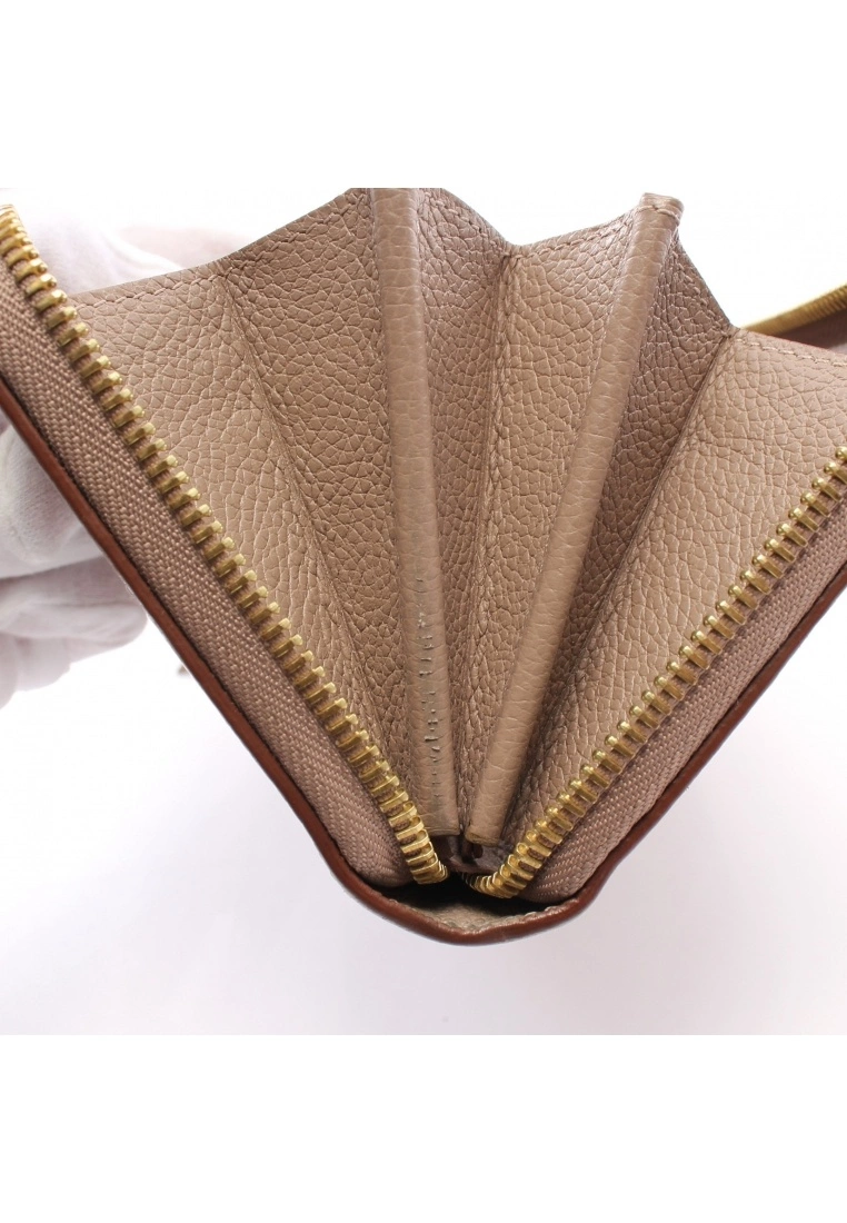 Pre-loved LOUIS VUITTON Classic Monogram empreinte embossed Rounded corner zipper long Genuine Leather Wallet Beige 9 Pre-loved LOUIS VUITTON Classic Monogram empreinte embossed Rounded corner zipper long Genuine Leather Wallet Beige - Image 7